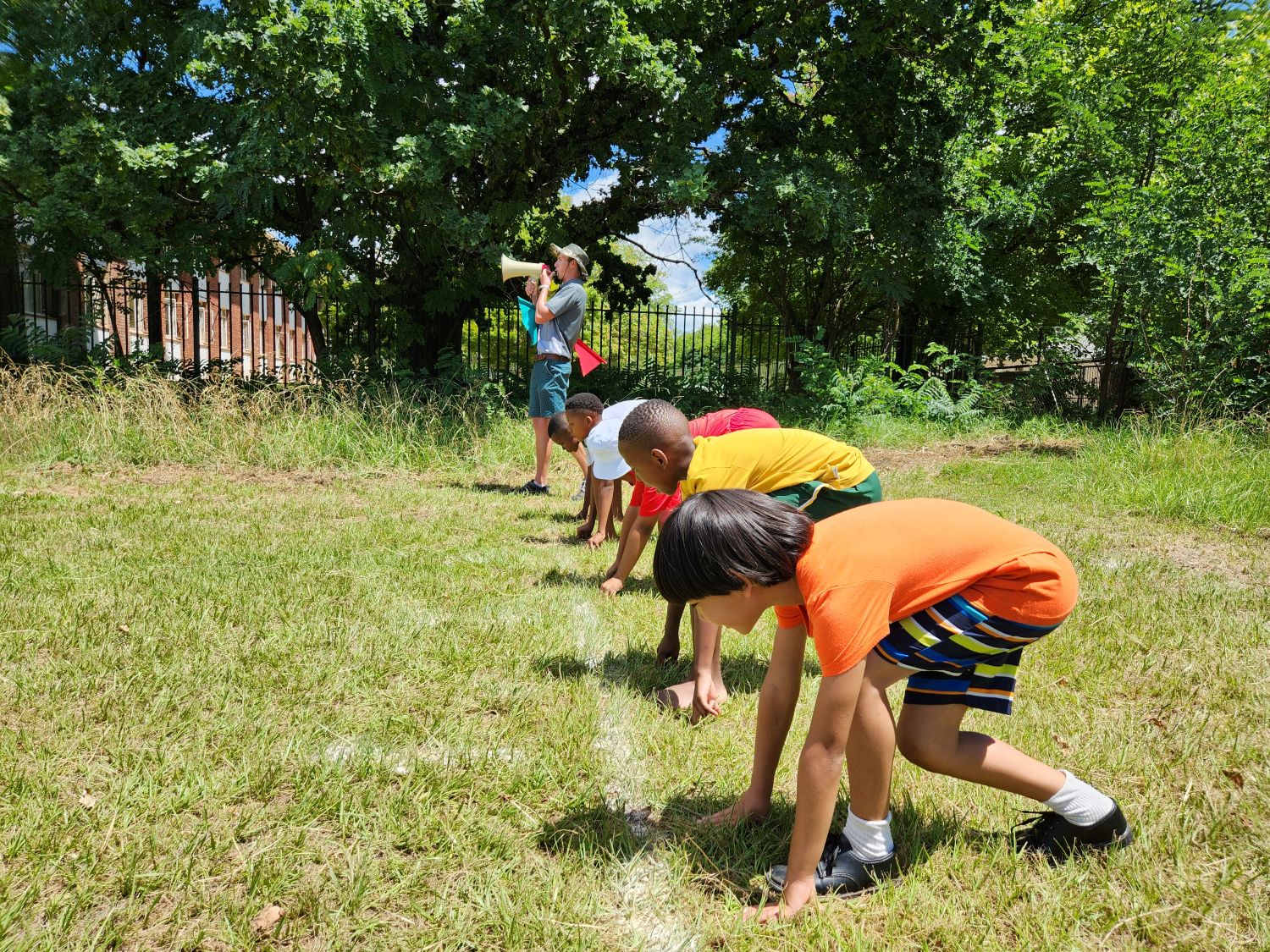 primary school learners about to start a race
